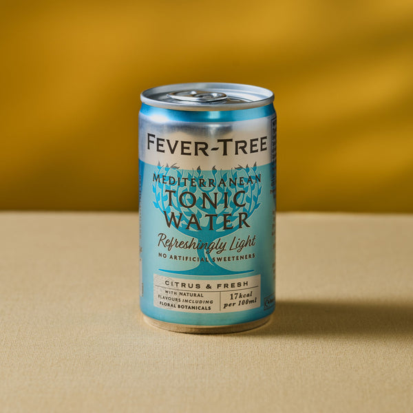 A can of Mother Root Mediterranean Tonic Water [8 x 150ml] sits on a beige surface with a yellow background.